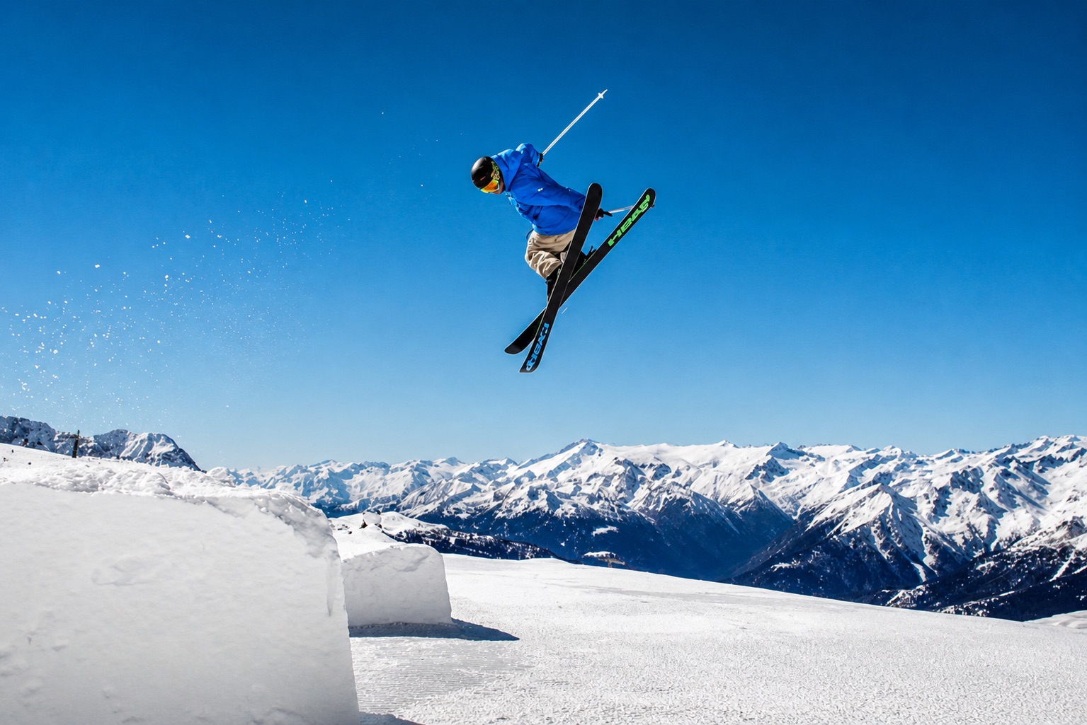 Freeride skier jumping above the Alps